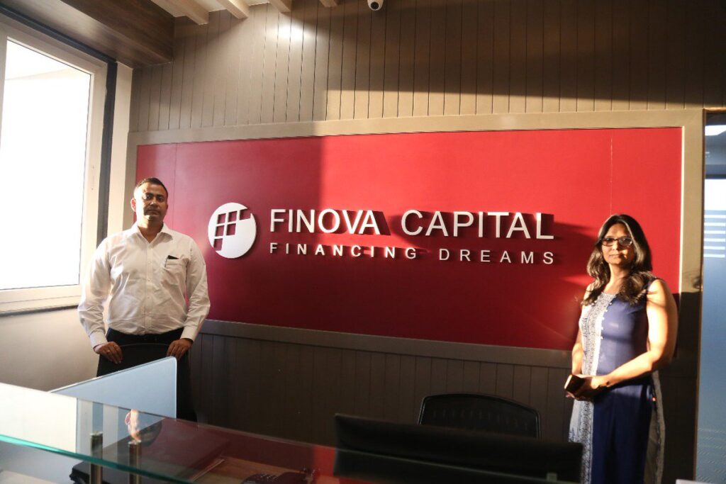 Finova Capital’s logo with a backdrop of financial charts and growth indicators, representing their INR 800 Cr fundraise to expand lending services and enhance technology for MSMEs and rural markets in India.